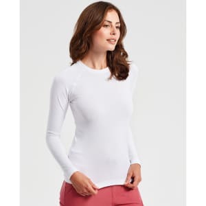 A white long-sleeve underscrub baselayer worn by a woman, featuring a fitted design and a simple style.