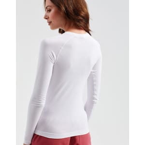 A white long-sleeve baselayer shirt with a fitted design, featuring a logo on the back.