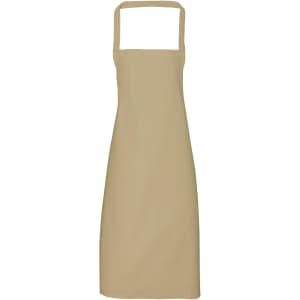 A beige 100% organic cotton bib apron with a simple design and adjustable neck straps, featuring a branding logo.