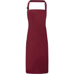 A waterproof bib apron in a deep burgundy colour, featuring an adjustable neck strap and a simple design.