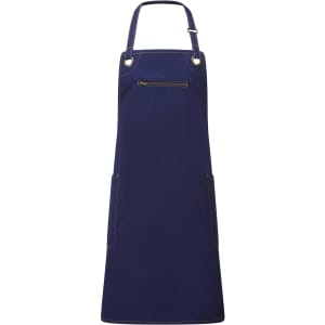 A navy blue bib apron featuring contrast stitching and a zippered pocket, with two side pockets and adjustable straps.