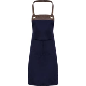 A navy blue apron with a brown top section and a central pocket, featuring metallic rivets. It has a logo on it.