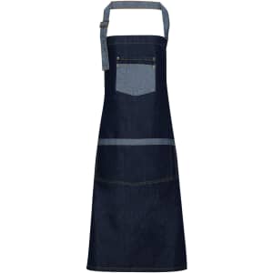 A denim bib apron in dark blue with contrasting light blue straps and pockets. It has a logo displayed.