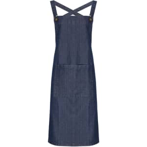 A denim cross back barista bib apron featuring adjustable straps and a front pocket. The apron has a logo.