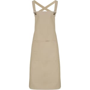A beige cross back bib apron featuring adjustable straps and a front pocket, with a logo on the fabric.