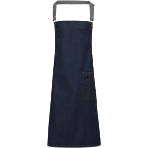 A dark blue denim bib apron featuring a front pocket and adjustable straps, with a logo present.