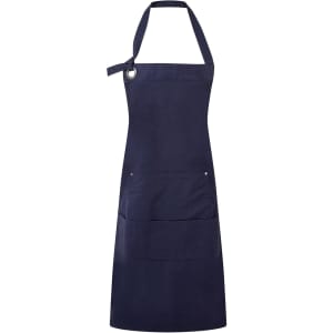 A navy blue heavy cotton canvas apron featuring an adjustable neck strap and multiple front pockets. It has a logo.