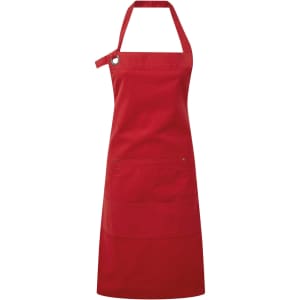 A red heavy cotton canvas pocket apron with an adjustable neck strap and three front pockets. Features a logo.