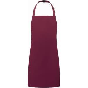 A burgundy kids bib apron with a halter neck and an adjustable strap, featuring a plain design and a branding logo.