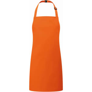 An orange kids bib apron with a halter neck design and adjustable strap. It features a logo.