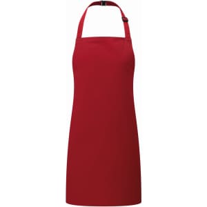 A red kids' bib apron featuring a halter neck design and a fastening at the back. It has a logo on the front.