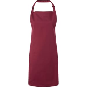 A burgundy bib apron with a neck strap and an adjustable tie at the back. It has a logo present.
