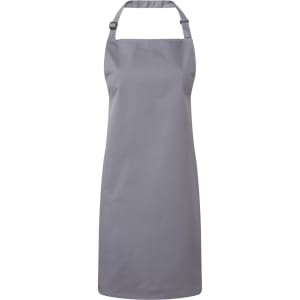 A grey bib apron with a neck strap and adjustable fastening, featuring a logo. Suitable for chefwear uniforms.