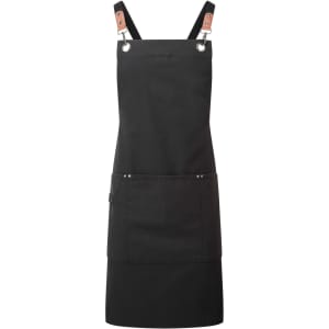 A black cross-back bib apron featuring leather accents and a front pocket, with a logo on the design.
