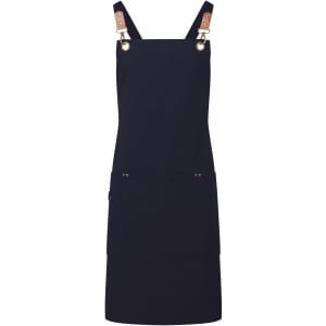 A navy blue cross-back bib apron featuring leather clasps and pockets, with a subtle logo.