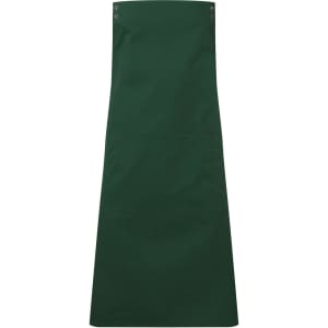 A dark green apron featuring button details and a spacious central pocket. The design includes branding.