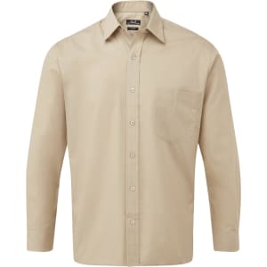 A beige button-up shirt with long sleeves and a chest pocket, featuring a logo.