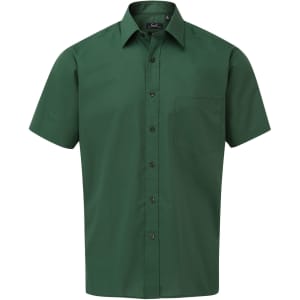 A short-sleeved button-up shirt in a deep green colour with a single chest pocket. Features a logo.