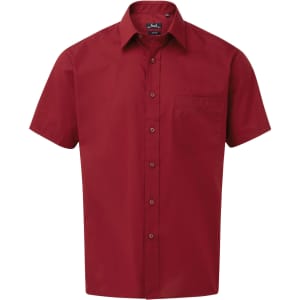 A short-sleeved button-up shirt in a deep red colour, featuring a pocket and a logo on the collar.