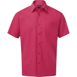 A short-sleeved pink button-up shirt with a chest pocket and a branded label.