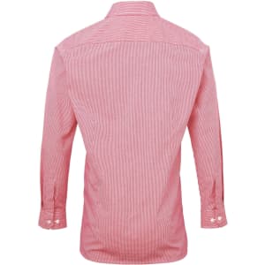 A red check patterned button-up shirt with long sleeves and a collared neckline. It features a logo.