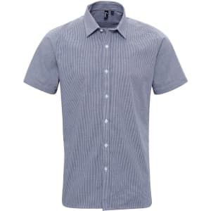 A short-sleeved button-up shirt in a microcheck pattern featuring shades of blue and white. It has a logo on the collar.