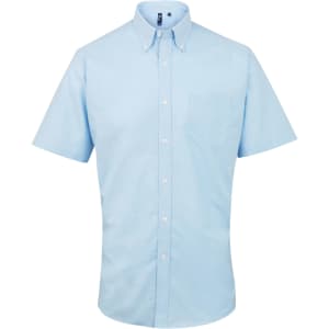 A short-sleeve button-up shirt in light blue with a pocket and a logo on the collar.