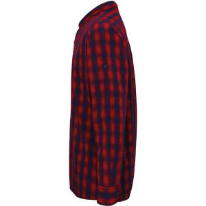 A side view of a red and navy checkered button-up shirt with a collar and long sleeves, featuring a logo.