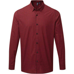 A red and black checked button-up shirt with long sleeves and a collar, featuring a logo.