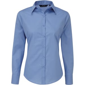 A light blue women's poplin long-sleeve blouse with a button-up front and a collar. It features a logo on the label.