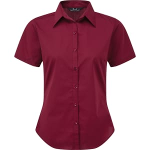 A burgundy women's button-up blouse with a collar and short sleeves, featuring a logo.