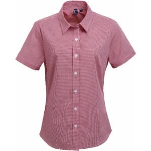 A short-sleeved women's shirt in red microcheck pattern, featuring a button-up front and a collar. Includes a logo.