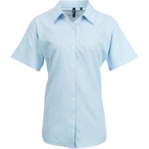 Light blue women's short-sleeve button-up shirt with a collar and a logo on the chest.