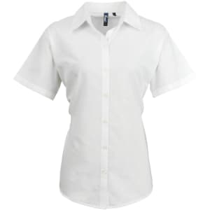 A white women's button-up shirt featuring short sleeves and a collar, with a logo on the label.