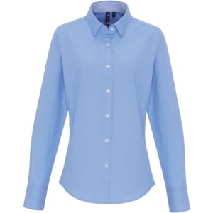 A light blue button-up blouse with a collared neck and long sleeves, featuring a logo.