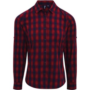 A check-patterned button-up shirt in red and navy, featuring long sleeves and a brand logo.