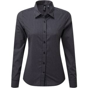 A black and white checked button-up shirt with long sleeves and a collar. Features a branding logo.