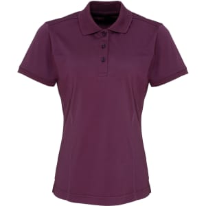 A women's polo shirt in deep purple, featuring a collar and three-button placket. Includes a logo on the chest.