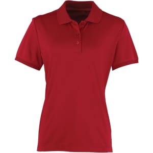 A red women's polo shirt with a classic collar and short sleeves. Features a logo on the chest area.
