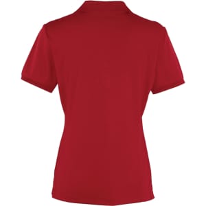 A red women's polo shirt with a collar and short sleeves, featuring a logo.