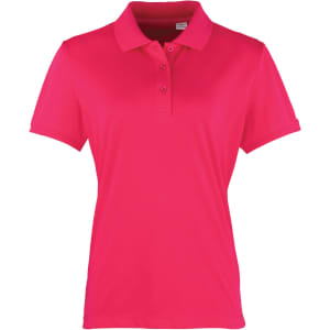A women's polo shirt in vibrant pink, featuring a collared neckline and short sleeves. It has a logo on the front.
