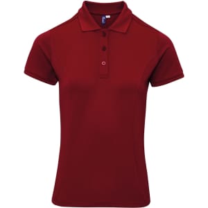 A red polo shirt with a collared neckline, short sleeves, and a logo on the front.