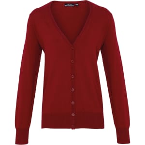 A women's button cardigan in a rich red colour with a V-neck and long sleeves. It features a logo on the label.