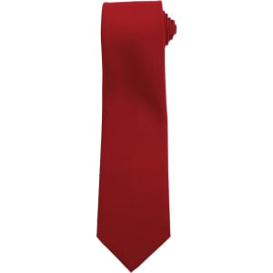A red tie with a pointed end, featuring a simple design and an attached logo.