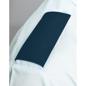 A blue epaulette on a light blue shirt sleeve, featuring a smooth, textured surface. The image includes branding.