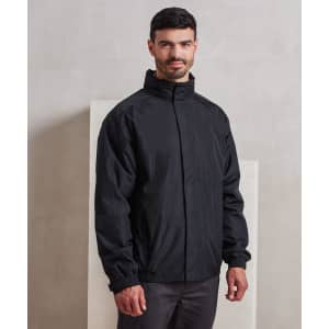 A man wearing a black waterproof jacket with a high collar, featuring a logo on the chest.