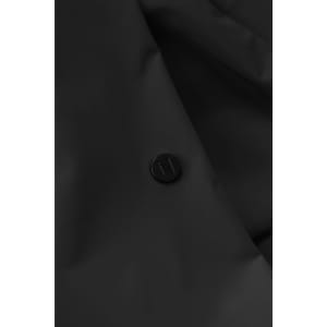 A black jacket featuring a textured surface and a round logo badge on the front.