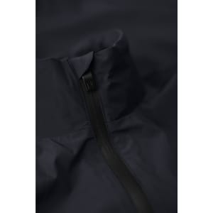 A navy men’s jacket featuring a high collar and zip closure. The fabric is smooth and appears water-resistant.