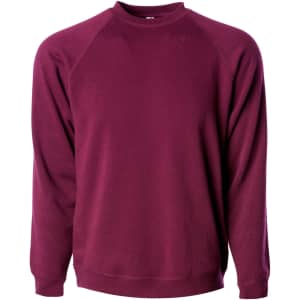 A maroon unisex crew sweatshirt with raglan sleeves and a round neckline. It has a logo on the front.