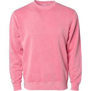A unisex crew sweatshirt in a soft pink colour, featuring long sleeves and a comfortable fit. It has a logo.